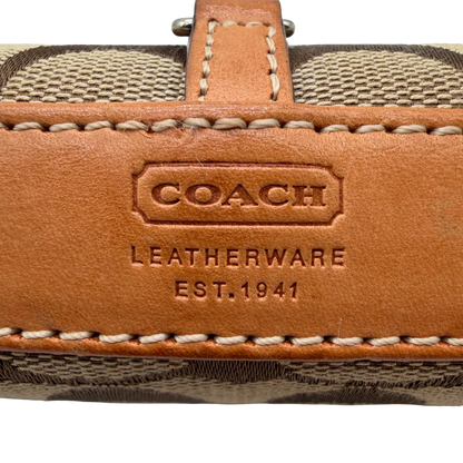 https://cdn.shopify.com/s/files/1/0564/9376/8855/files/Coach_Pochette_Signature_Soho_monogram_beige_11.webp?v=1782311319