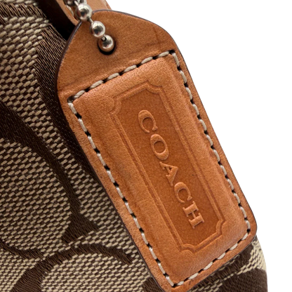 https://cdn.shopify.com/s/files/1/0564/9376/8855/files/Coach_Pochette_Signature_Soho_monogram_beige_12.webp?v=1782311319