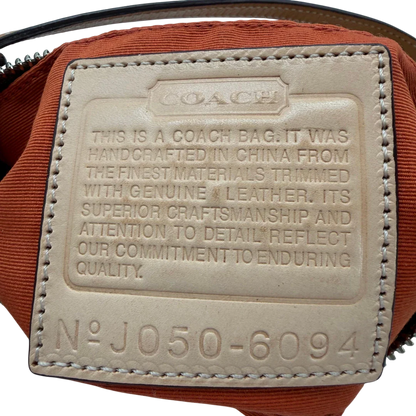 https://cdn.shopify.com/s/files/1/0564/9376/8855/files/Coach_Pochette_Signature_beige_vintage6359.webp?v=1778669418