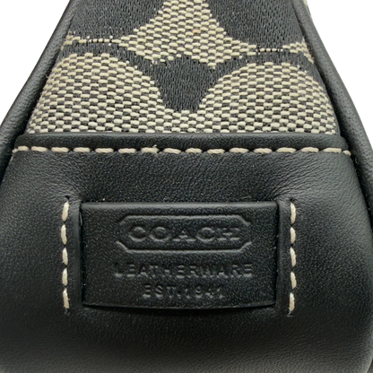 https://cdn.shopify.com/s/files/1/0564/9376/8855/files/Coach_Pochette_Signature_grau___schwarz_12.webp?v=1782910067