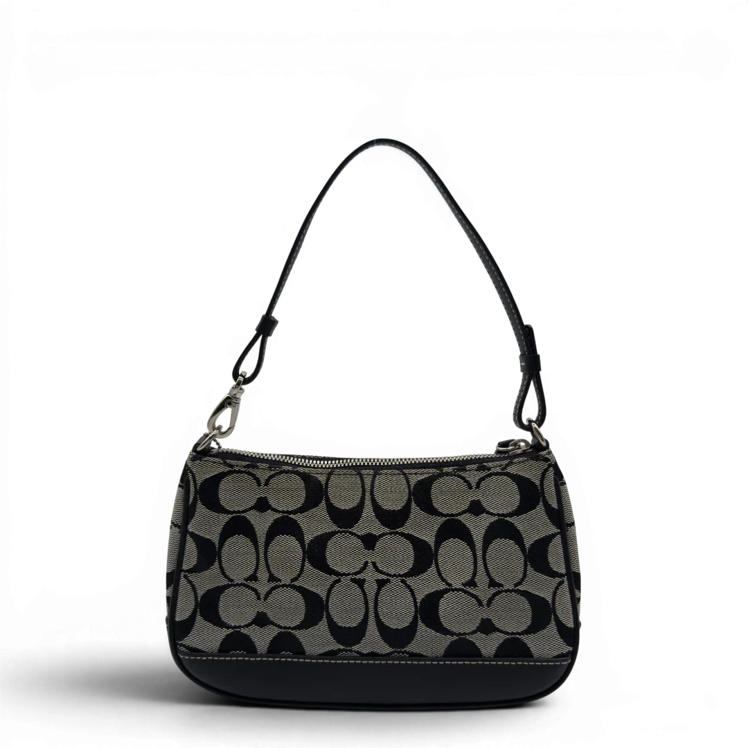 https://cdn.shopify.com/s/files/1/0564/9376/8855/files/Coach_Pochette_Signature_grau___schwarz_2.webp?v=1782910067