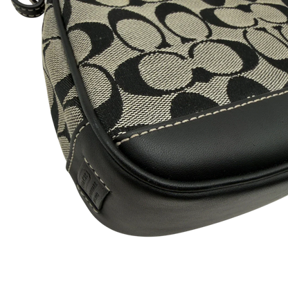 https://cdn.shopify.com/s/files/1/0564/9376/8855/files/Coach_Pochette_Signature_grau___schwarz_7.webp?v=1782910067