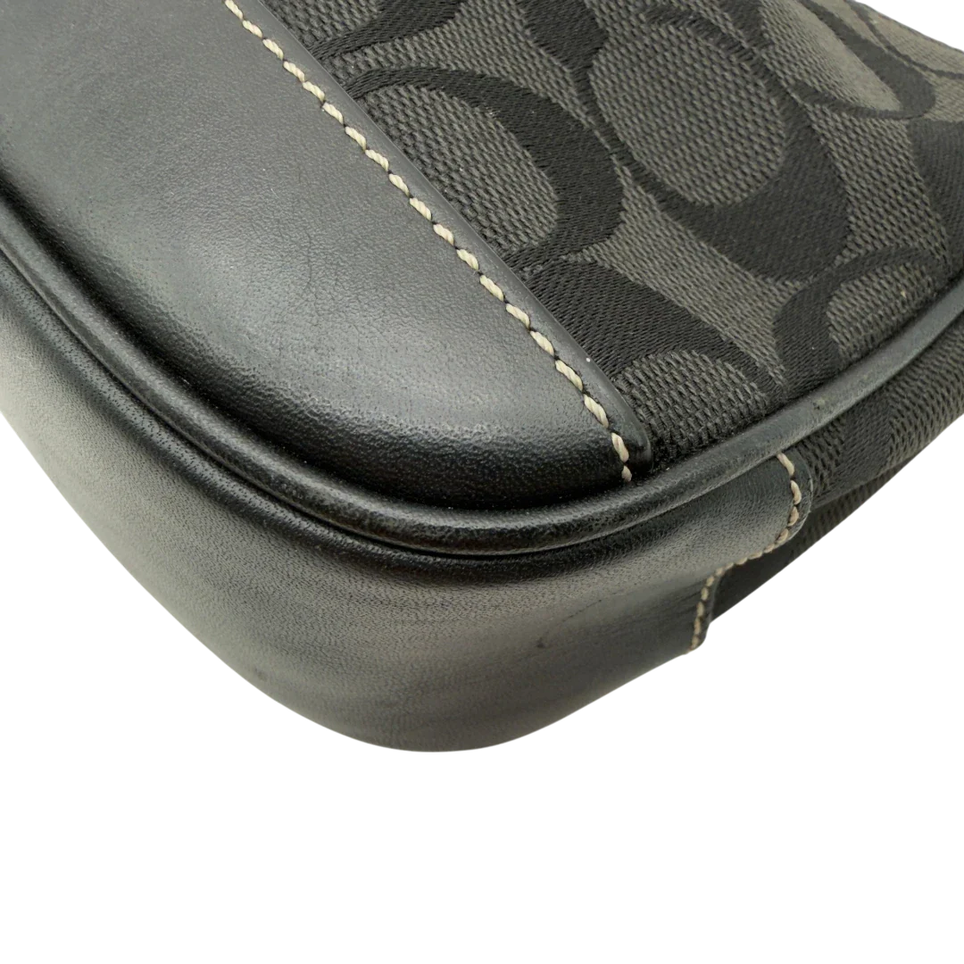 https://cdn.shopify.com/s/files/1/0564/9376/8855/files/Coach_Pochette_Signature_schwarz_vintage8265.webp?v=1780409233