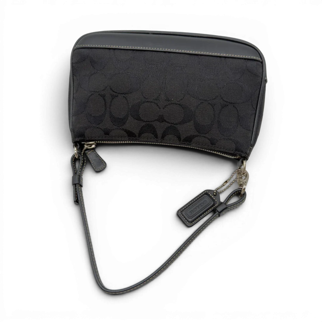 https://cdn.shopify.com/s/files/1/0564/9376/8855/files/Coach_Pochette_Signature_schwarz_vintage8269.webp?v=1780409233