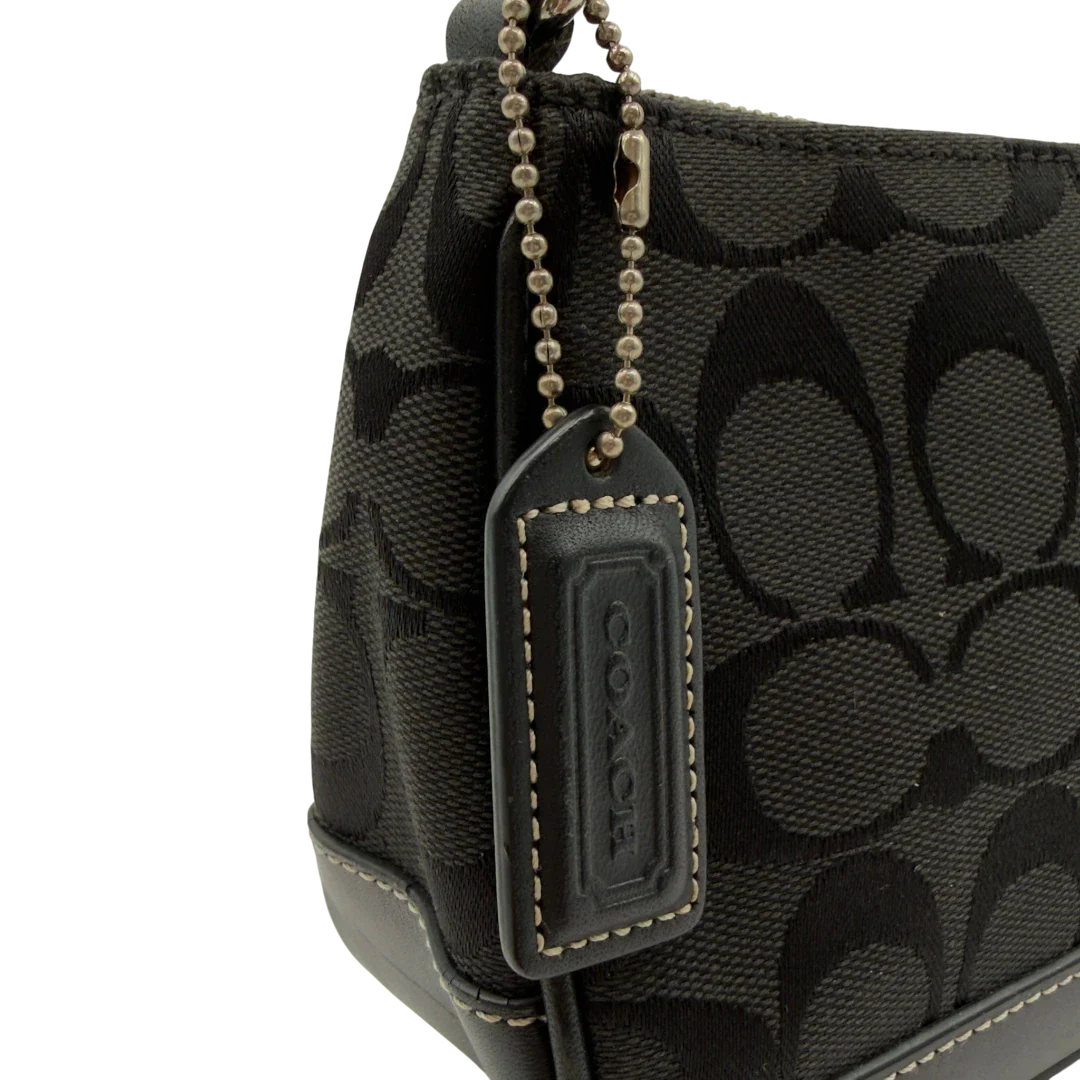 https://cdn.shopify.com/s/files/1/0564/9376/8855/files/Coach_Pochette_Signature_schwarz_vintage8270.webp?v=1780409234