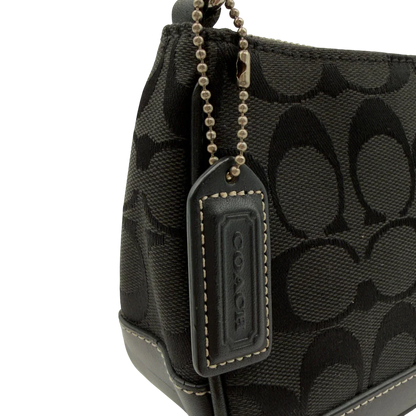 https://cdn.shopify.com/s/files/1/0564/9376/8855/files/Coach_Pochette_Signature_schwarz_vintage8270.webp?v=1780409234