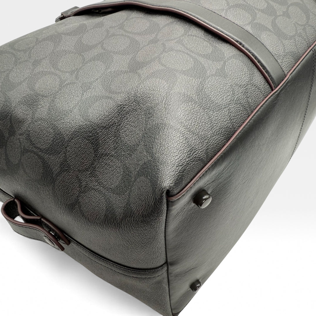 https://cdn.shopify.com/s/files/1/0564/9376/8855/files/Coach_Reisetasche_45_Signature_schwarz_vintage_dufflebag_5889.webp?v=1765451513