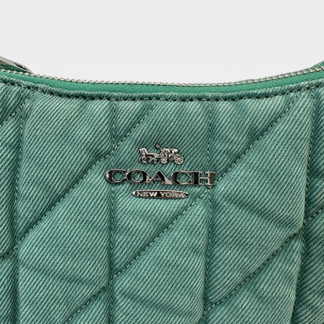 https://cdn.shopify.com/s/files/1/0564/9376/8855/files/Coach_Schultertasche_Baguette_Form_aus_Cord_grun_shoulder_bag9551.webp?v=1761265994