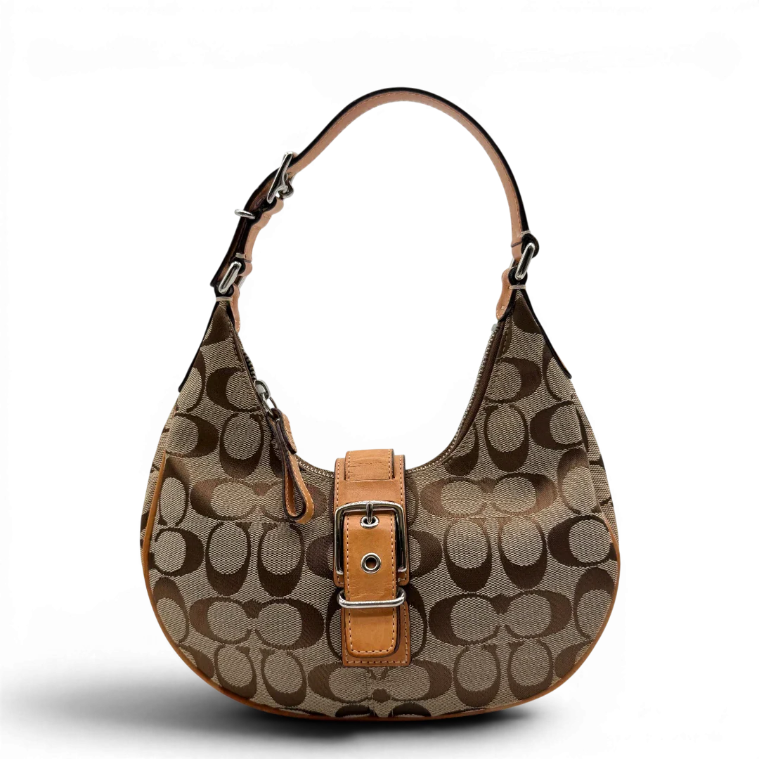 https://cdn.shopify.com/s/files/1/0564/9376/8855/files/Coach_Schultertasche_Croissant_Signature_beige___braun_1.webp?v=1782312030