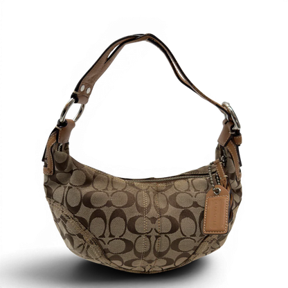 https://cdn.shopify.com/s/files/1/0564/9376/8855/files/Coach_Schultertasche_Hobo_Half_Moon_Signature_beige_1.webp?v=1782897227