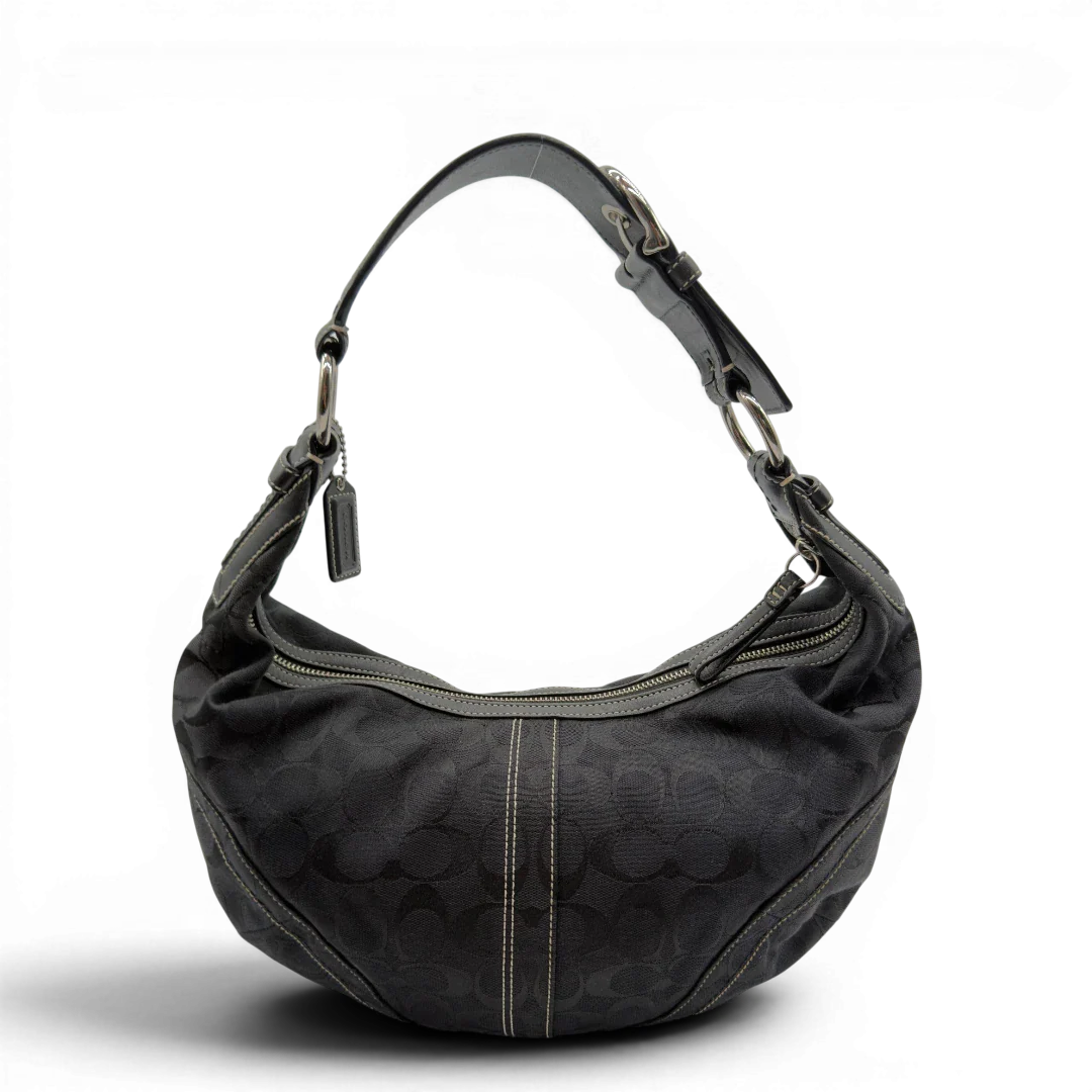 https://cdn.shopify.com/s/files/1/0564/9376/8855/files/Coach_Schultertasche_Hobo_Half_Moon_Signature_schwarz_vintage7353.webp?v=1778671516
