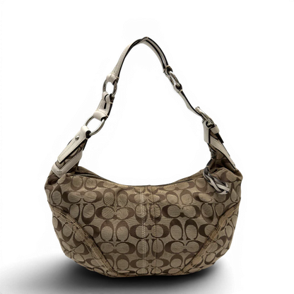 https://cdn.shopify.com/s/files/1/0564/9376/8855/files/Coach_Schultertasche_Hobo_Signature_beige_1.webp?v=1782896788