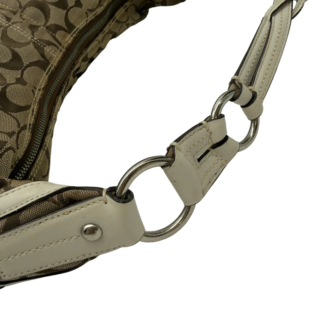 https://cdn.shopify.com/s/files/1/0564/9376/8855/files/Coach_Schultertasche_Hobo_Signature_beige_11.webp?v=1782896788