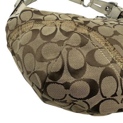 https://cdn.shopify.com/s/files/1/0564/9376/8855/files/Coach_Schultertasche_Hobo_Signature_beige_6.webp?v=1782896788