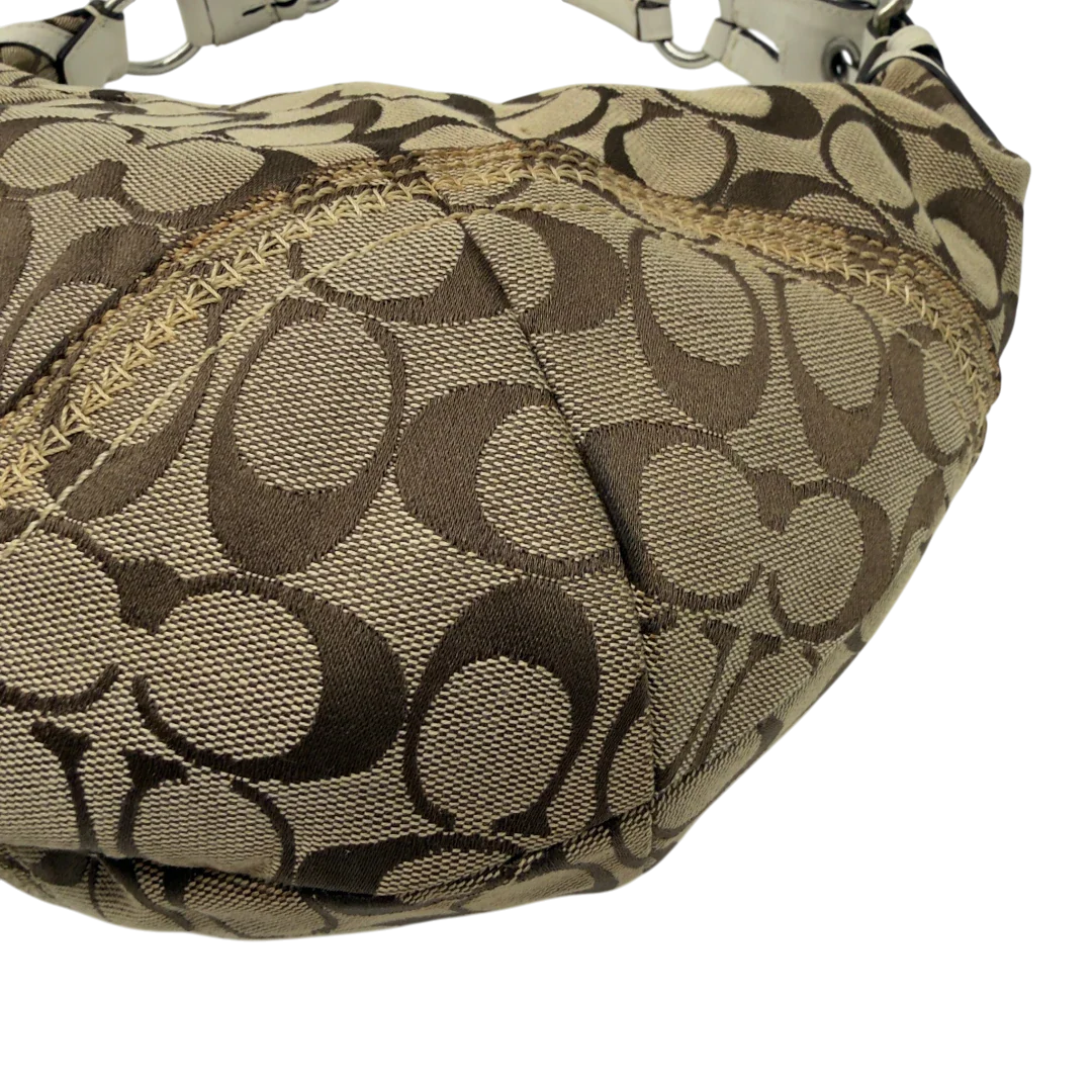 https://cdn.shopify.com/s/files/1/0564/9376/8855/files/Coach_Schultertasche_Hobo_Signature_beige_7.webp?v=1782896788