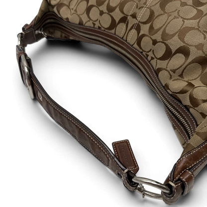 https://cdn.shopify.com/s/files/1/0564/9376/8855/files/Coach_Schultertasche_Hobo_Signature_beige___braun_vintage7895.webp?v=1780490025