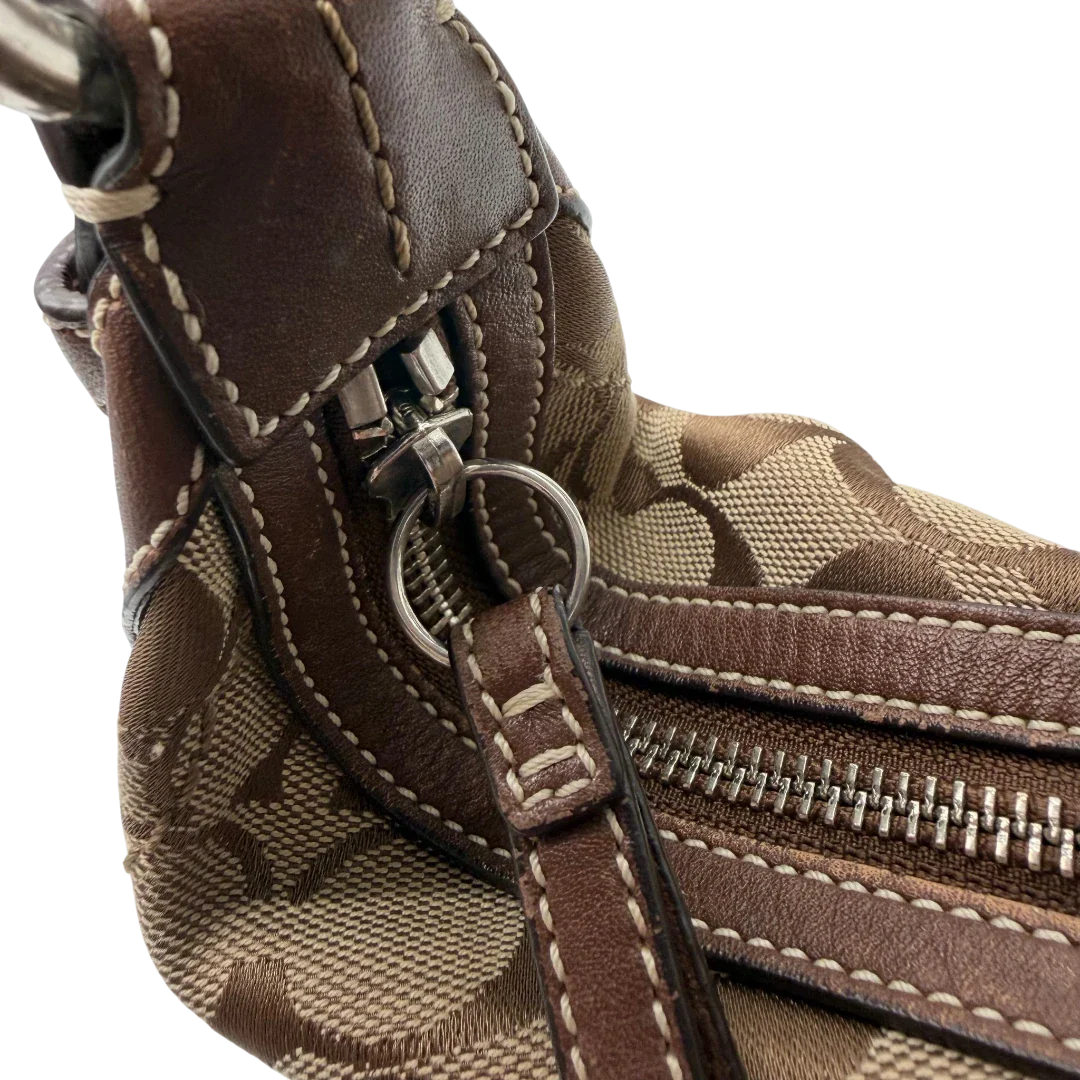 https://cdn.shopify.com/s/files/1/0564/9376/8855/files/Coach_Schultertasche_Hobo_Signature_beige___braun_vintage7898.webp?v=1780490025