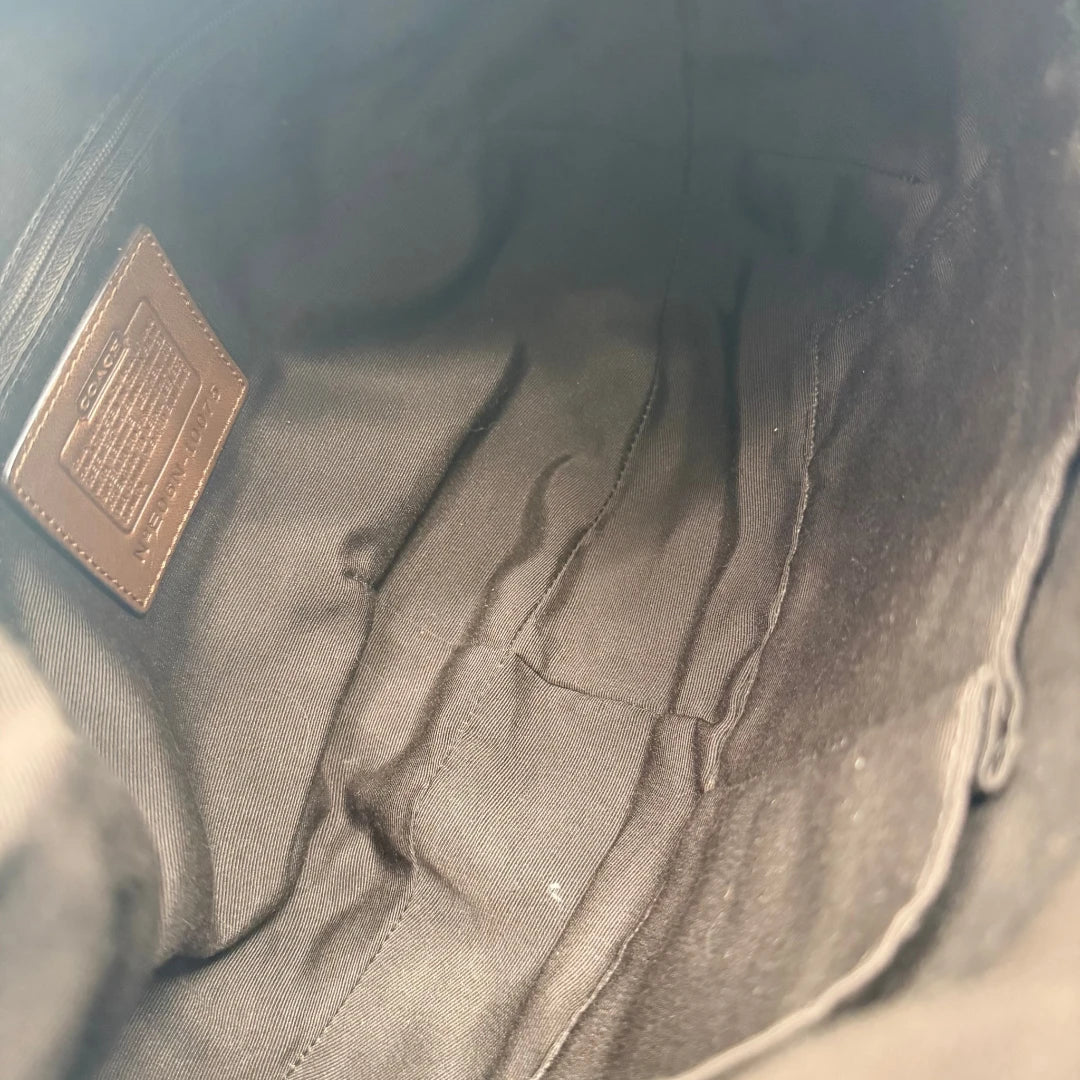 https://cdn.shopify.com/s/files/1/0564/9376/8855/files/Coach_Schultertasche_Hobo_Signature_beige___braun_vintage7899.webp?v=1780490025