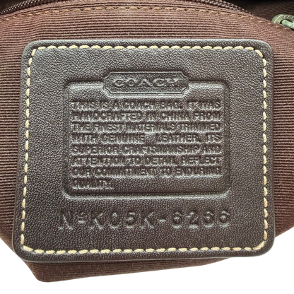 https://cdn.shopify.com/s/files/1/0564/9376/8855/files/Coach_Schultertasche_Hobo_Signature_beige_vintage5199.png?v=1776767886