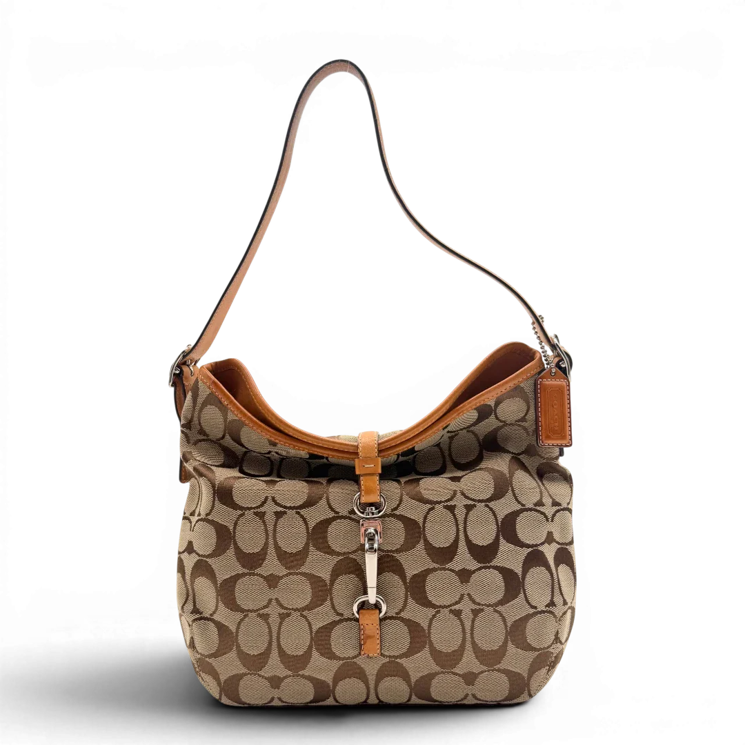 https://cdn.shopify.com/s/files/1/0564/9376/8855/files/Coach_Schultertasche_Jackie_Bucket_Signature_beige_1.webp?v=1782312193