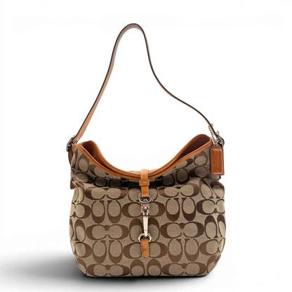 https://cdn.shopify.com/s/files/1/0564/9376/8855/files/Coach_Schultertasche_Jackie_Bucket_Signature_beige_1.webp?v=1782312193