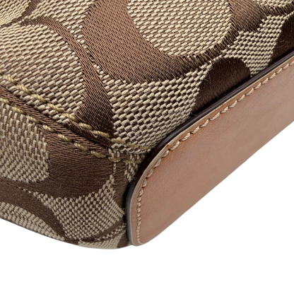https://cdn.shopify.com/s/files/1/0564/9376/8855/files/Coach_Schultertasche_Jackie_Bucket_Signature_beige_9.webp?v=1782312194