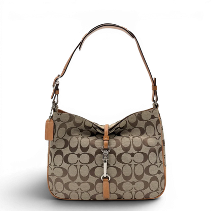 https://cdn.shopify.com/s/files/1/0564/9376/8855/files/Coach_Schultertasche_Jackie_Signature_beige_vintage7904.webp?v=1780489714