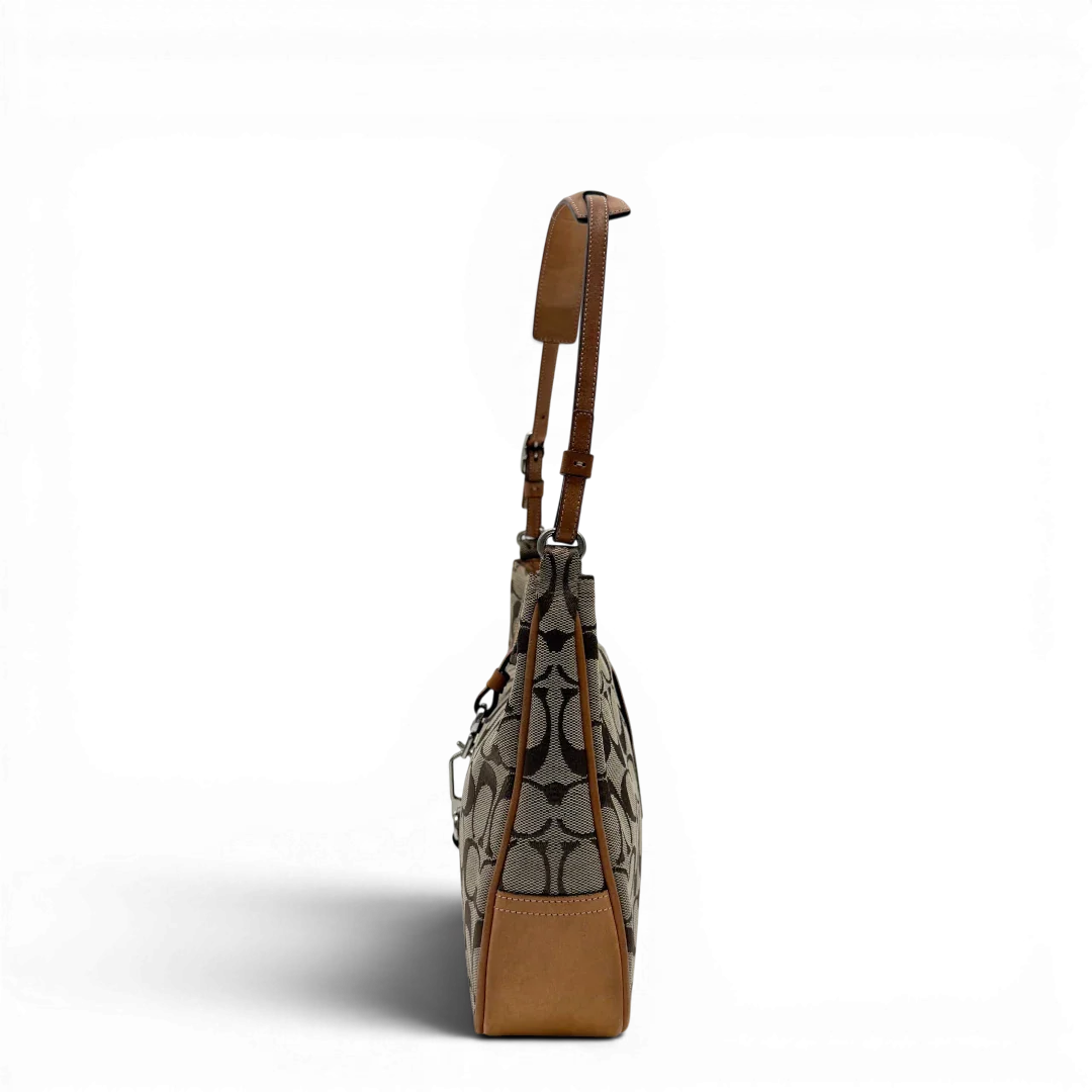 https://cdn.shopify.com/s/files/1/0564/9376/8855/files/Coach_Schultertasche_Jackie_Signature_beige_vintage7911.webp?v=1780489713