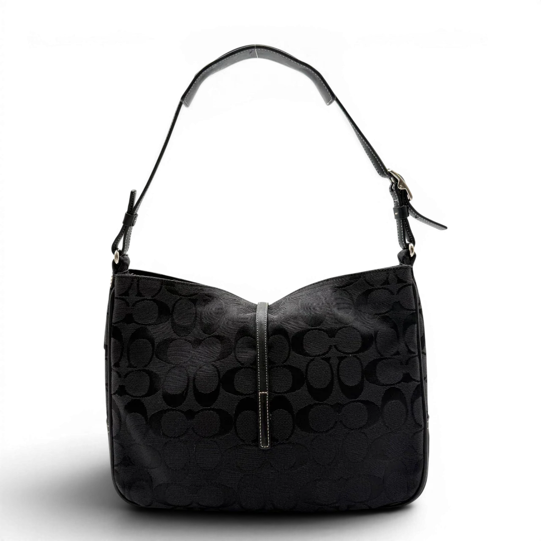 https://cdn.shopify.com/s/files/1/0564/9376/8855/files/Coach_Schultertasche_Jackie_Signature_schwarz_2.webp?v=1782310599