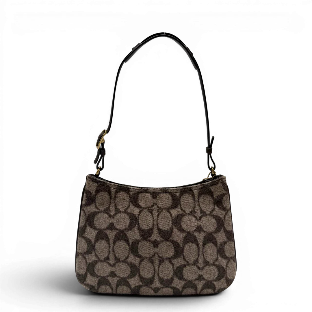 https://cdn.shopify.com/s/files/1/0564/9376/8855/files/Coach_Schultertasche_Signature_aus_Wolle_beige_vintage7712.webp?v=1780487596
