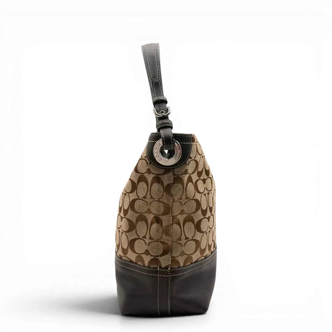 https://cdn.shopify.com/s/files/1/0564/9376/8855/files/Coach_Schultertasche_Signature_beige___braun_4.webp?v=1782312990