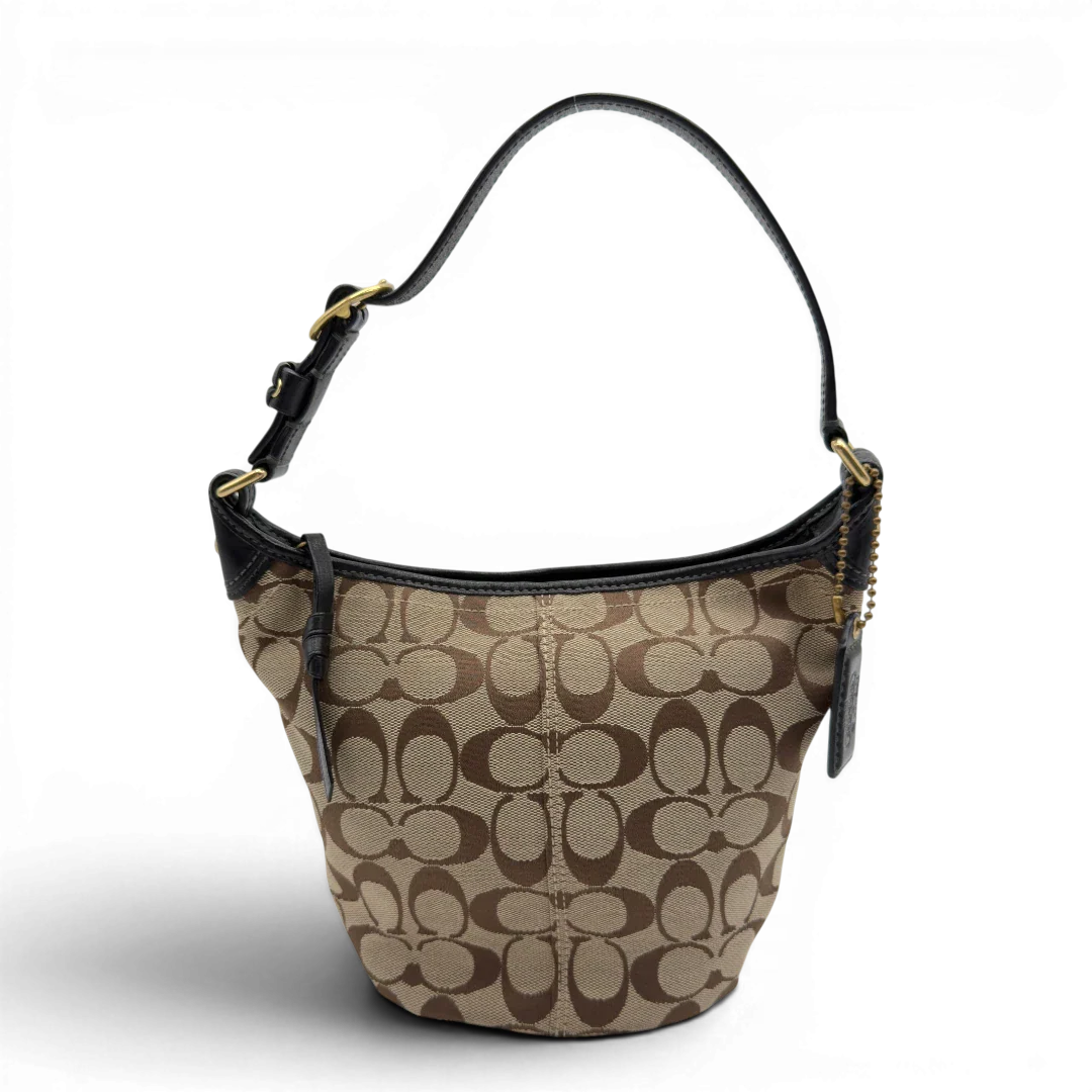 https://cdn.shopify.com/s/files/1/0564/9376/8855/files/Coach_Schultertasche_Signature_beige___schwarz_1.webp?v=1782910164