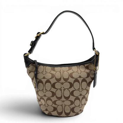 https://cdn.shopify.com/s/files/1/0564/9376/8855/files/Coach_Schultertasche_Signature_beige___schwarz_1.webp?v=1782910164