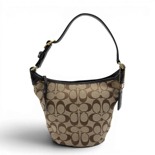 https://cdn.shopify.com/s/files/1/0564/9376/8855/files/Coach_Schultertasche_Signature_beige___schwarz_1.webp?v=1782910164