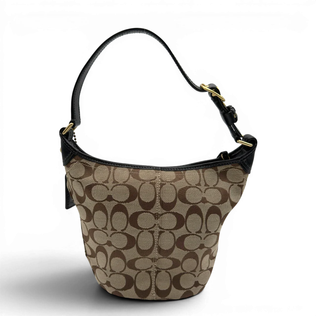 https://cdn.shopify.com/s/files/1/0564/9376/8855/files/Coach_Schultertasche_Signature_beige___schwarz_2.webp?v=1782910164