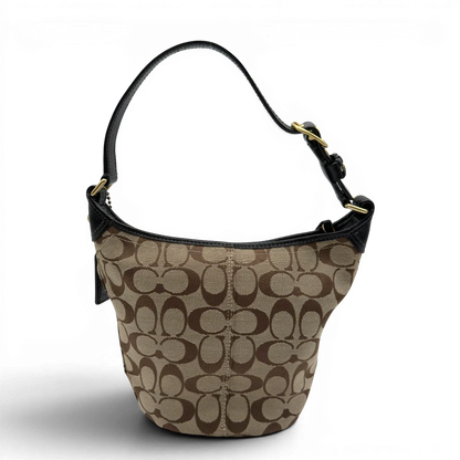 https://cdn.shopify.com/s/files/1/0564/9376/8855/files/Coach_Schultertasche_Signature_beige___schwarz_2.webp?v=1782910164