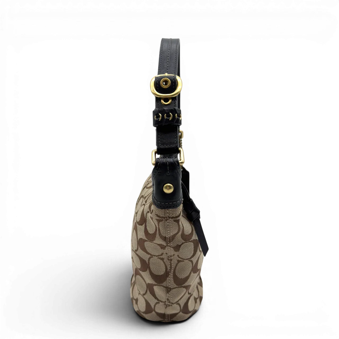 https://cdn.shopify.com/s/files/1/0564/9376/8855/files/Coach_Schultertasche_Signature_beige___schwarz_3.webp?v=1782910163