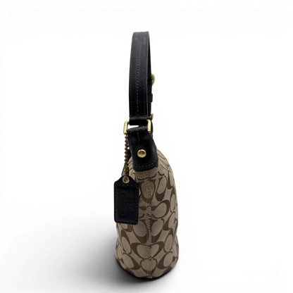 https://cdn.shopify.com/s/files/1/0564/9376/8855/files/Coach_Schultertasche_Signature_beige___schwarz_4.webp?v=1782910163