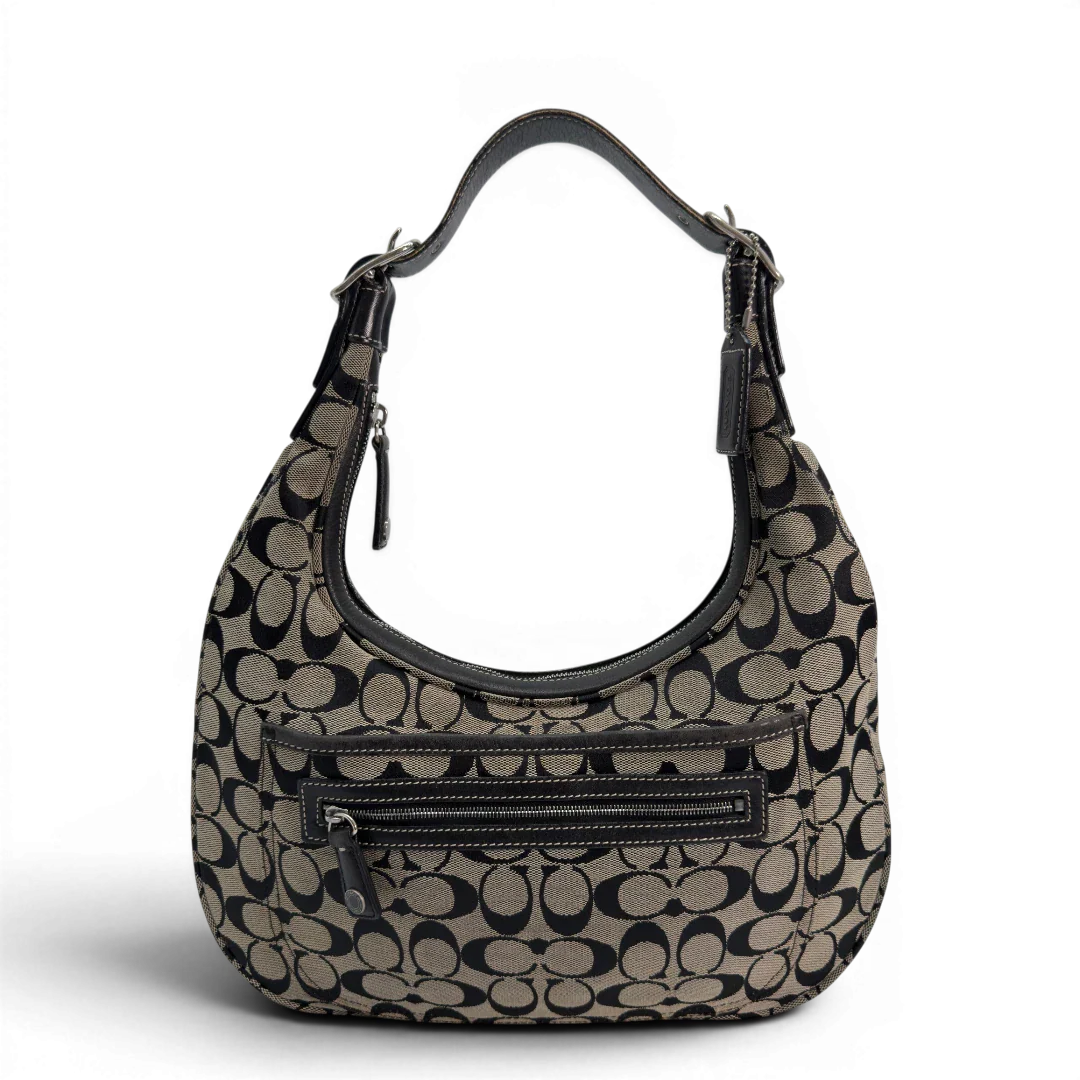 https://cdn.shopify.com/s/files/1/0564/9376/8855/files/Coach_Schultertasche_Signature_beige___schwarz_vintage8705.webp?v=1781084794