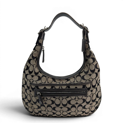 https://cdn.shopify.com/s/files/1/0564/9376/8855/files/Coach_Schultertasche_Signature_beige___schwarz_vintage8705.webp?v=1781084794