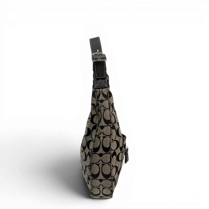 https://cdn.shopify.com/s/files/1/0564/9376/8855/files/Coach_Schultertasche_Signature_beige___schwarz_vintage8707.webp?v=1781084794