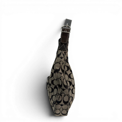 https://cdn.shopify.com/s/files/1/0564/9376/8855/files/Coach_Schultertasche_Signature_beige___schwarz_vintage8708.webp?v=1781084794