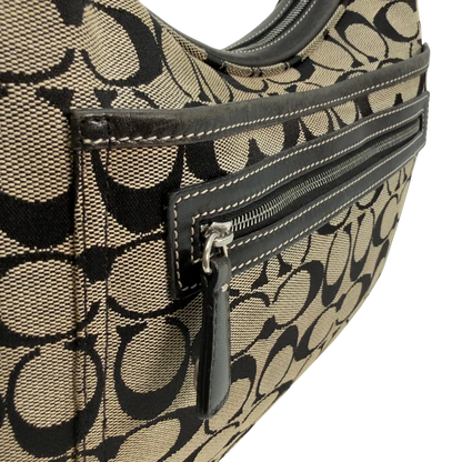 https://cdn.shopify.com/s/files/1/0564/9376/8855/files/Coach_Schultertasche_Signature_beige___schwarz_vintage8717.webp?v=1781084795