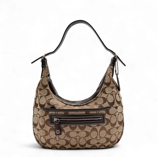 https://cdn.shopify.com/s/files/1/0564/9376/8855/files/Coach_Schultertasche_Signature_beige_braun_vintage5008.png?v=1776852884