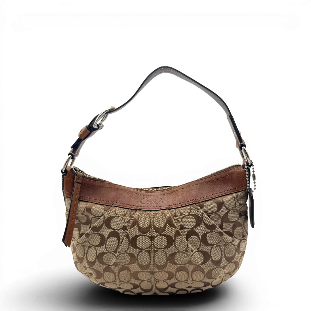 https://cdn.shopify.com/s/files/1/0564/9376/8855/files/Coach_Schultertasche_Signature_large_beige___braun_1.webp?v=1782312708