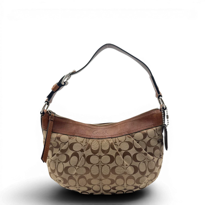 https://cdn.shopify.com/s/files/1/0564/9376/8855/files/Coach_Schultertasche_Signature_large_beige___braun_1.webp?v=1782312708