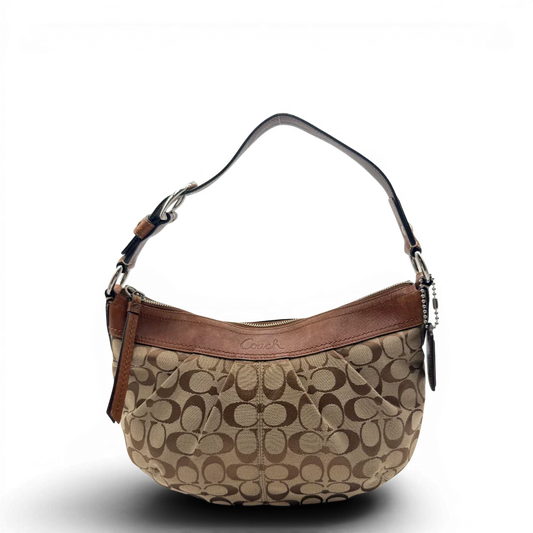 https://cdn.shopify.com/s/files/1/0564/9376/8855/files/Coach_Schultertasche_Signature_large_beige___braun_1.webp?v=1782312708