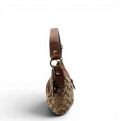 https://cdn.shopify.com/s/files/1/0564/9376/8855/files/Coach_Schultertasche_Signature_large_beige___braun_3.webp?v=1782312708