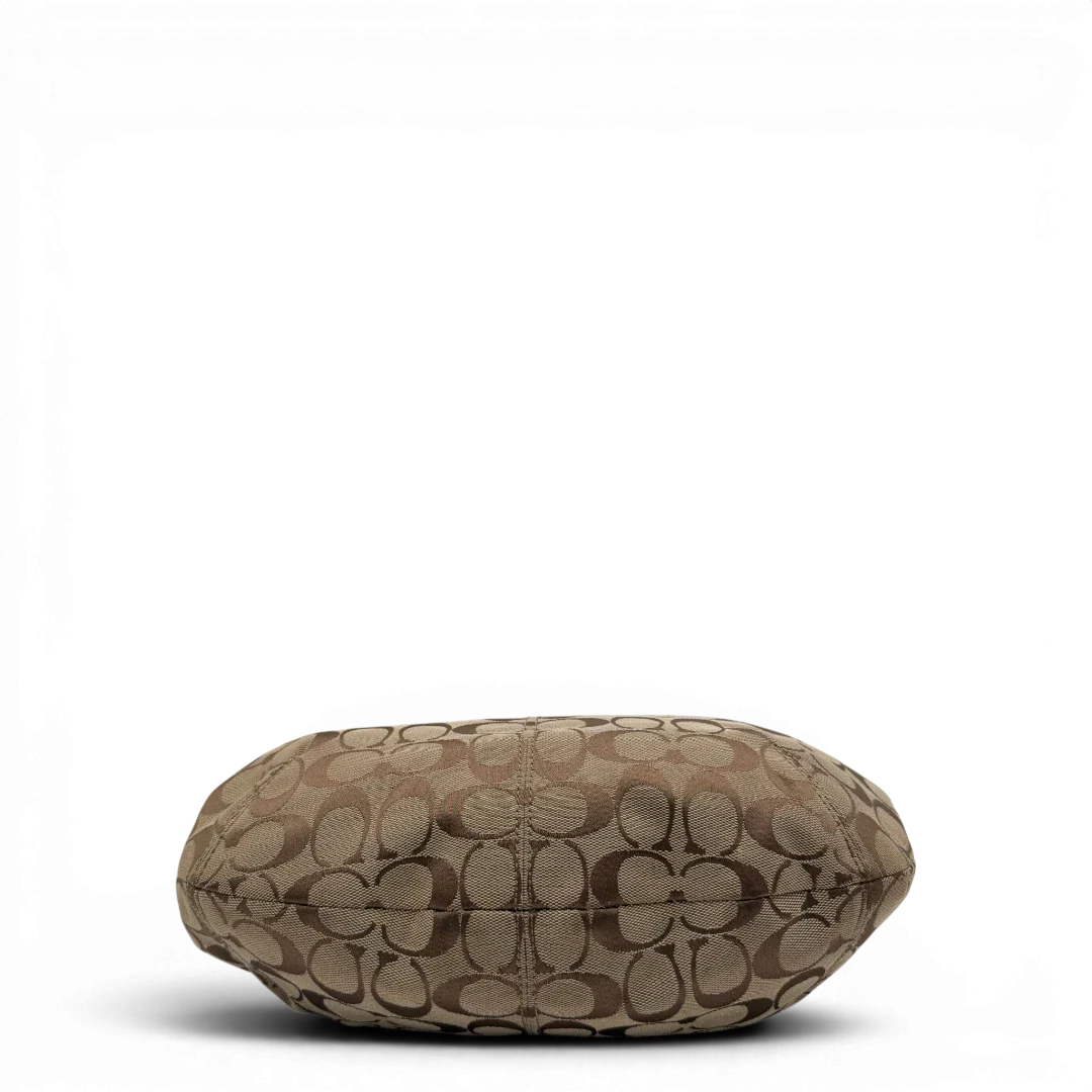 https://cdn.shopify.com/s/files/1/0564/9376/8855/files/Coach_Schultertasche_Signature_large_beige___braun_vintage8038.webp?v=1780489160