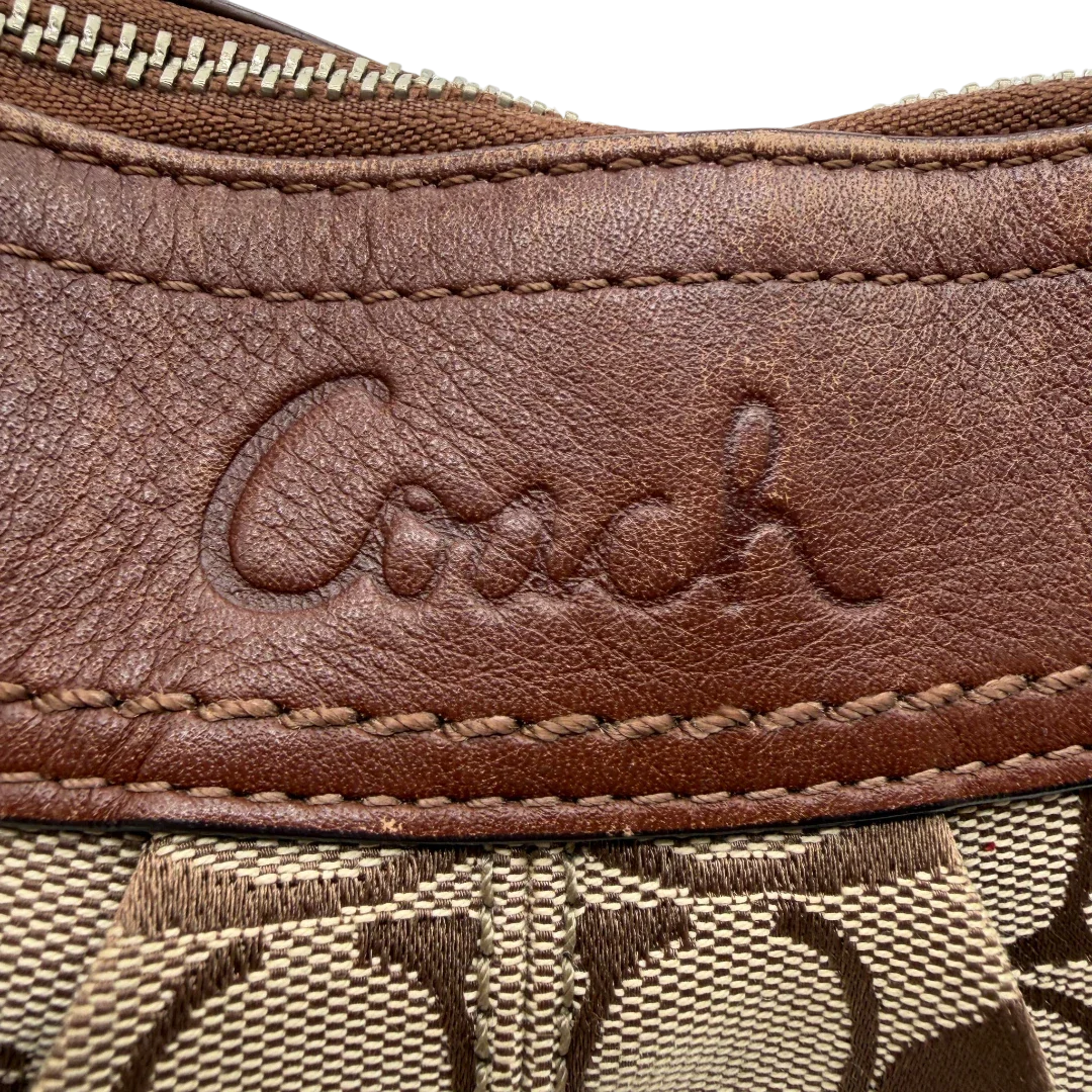 https://cdn.shopify.com/s/files/1/0564/9376/8855/files/Coach_Schultertasche_Signature_large_beige___braun_vintage8044.webp?v=1780489160